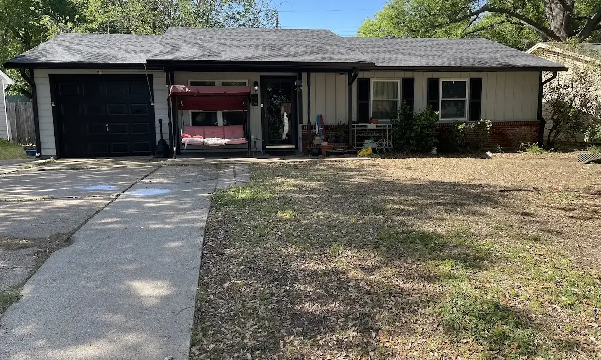 Wind Damage Roof Repair crew at work on a residential roof in Eustis